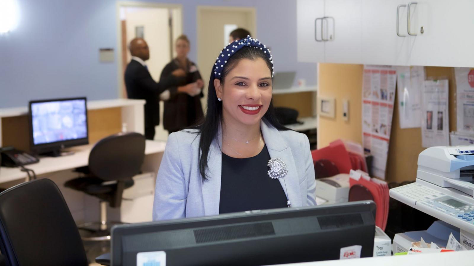 A woman smiling for a photo.