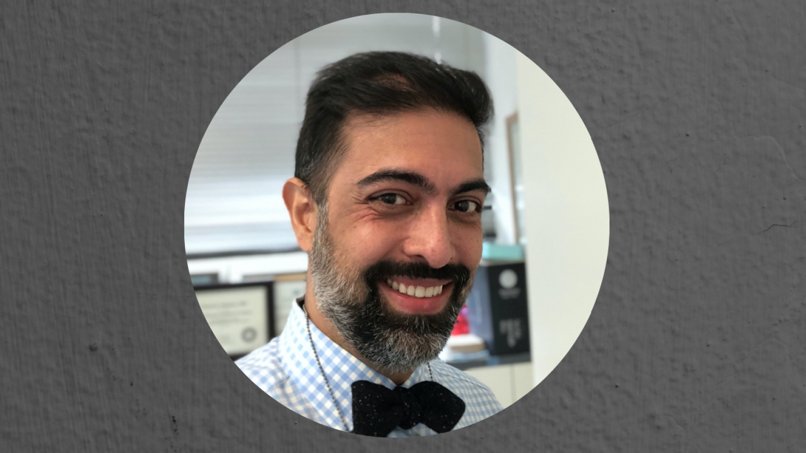 Smiling man wearing a bow tie