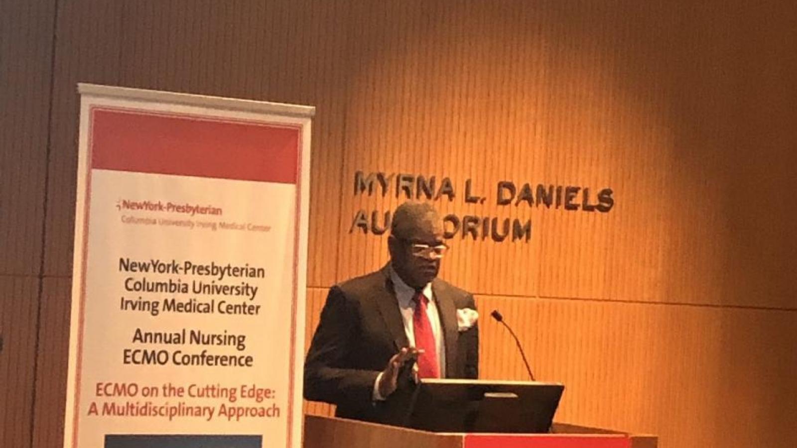 Man speaking at podium