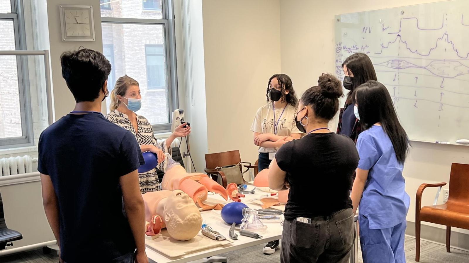 Doctor insructing students on airway management