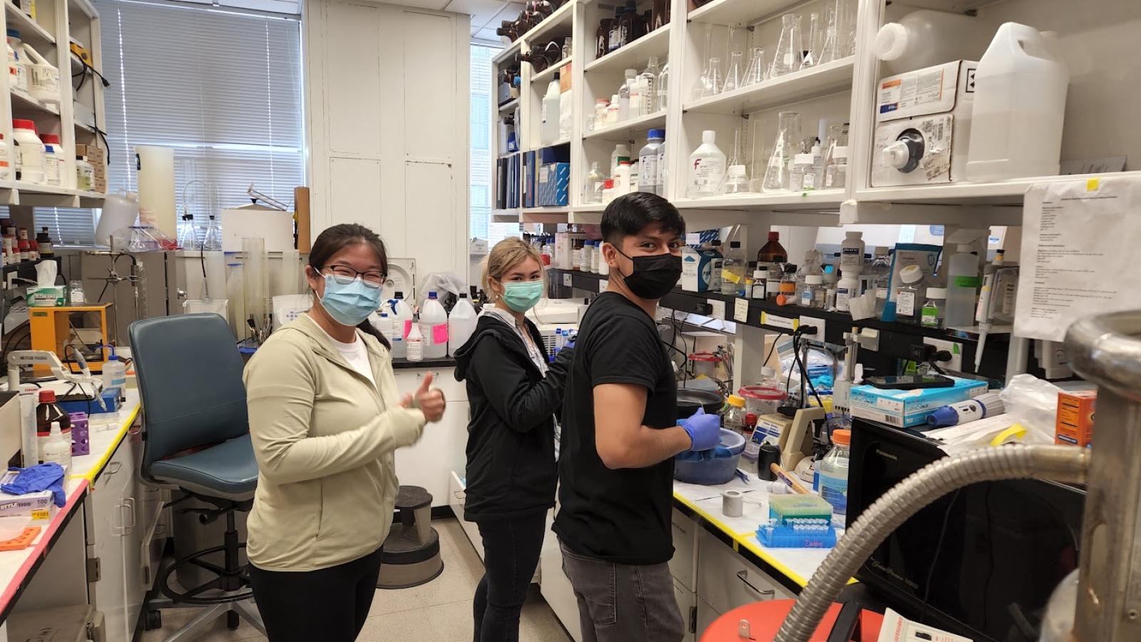 Masked students working in lab