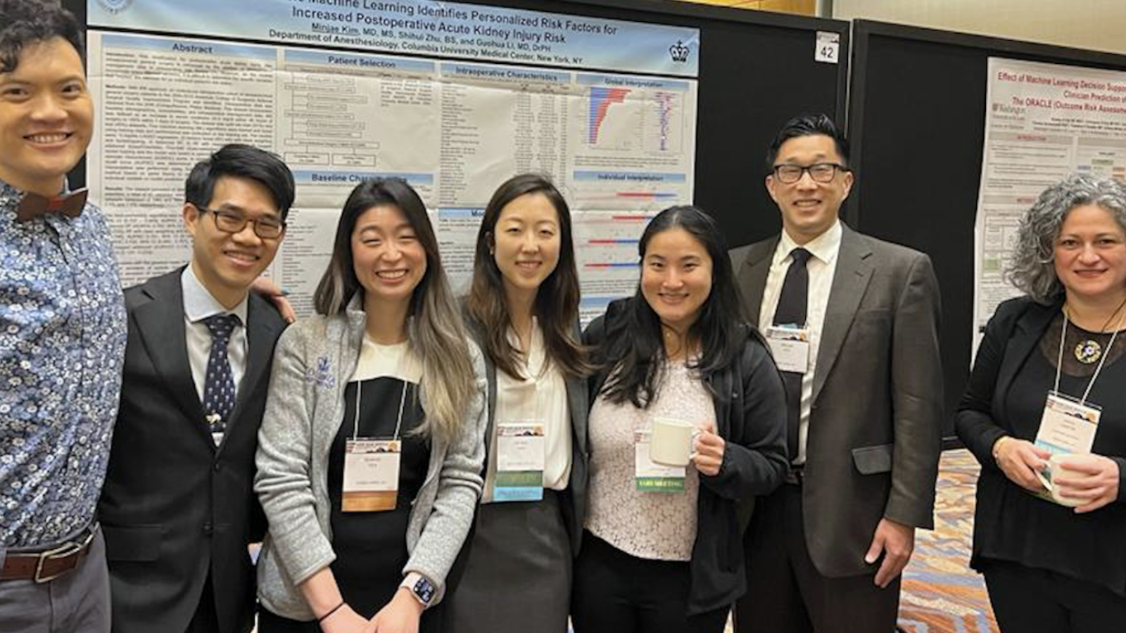 Group of men and women at scientific meeting