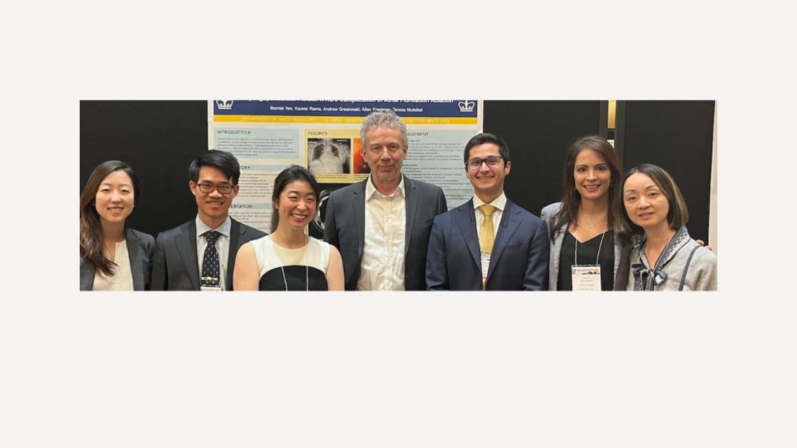 Group of men and women at scientific meeting