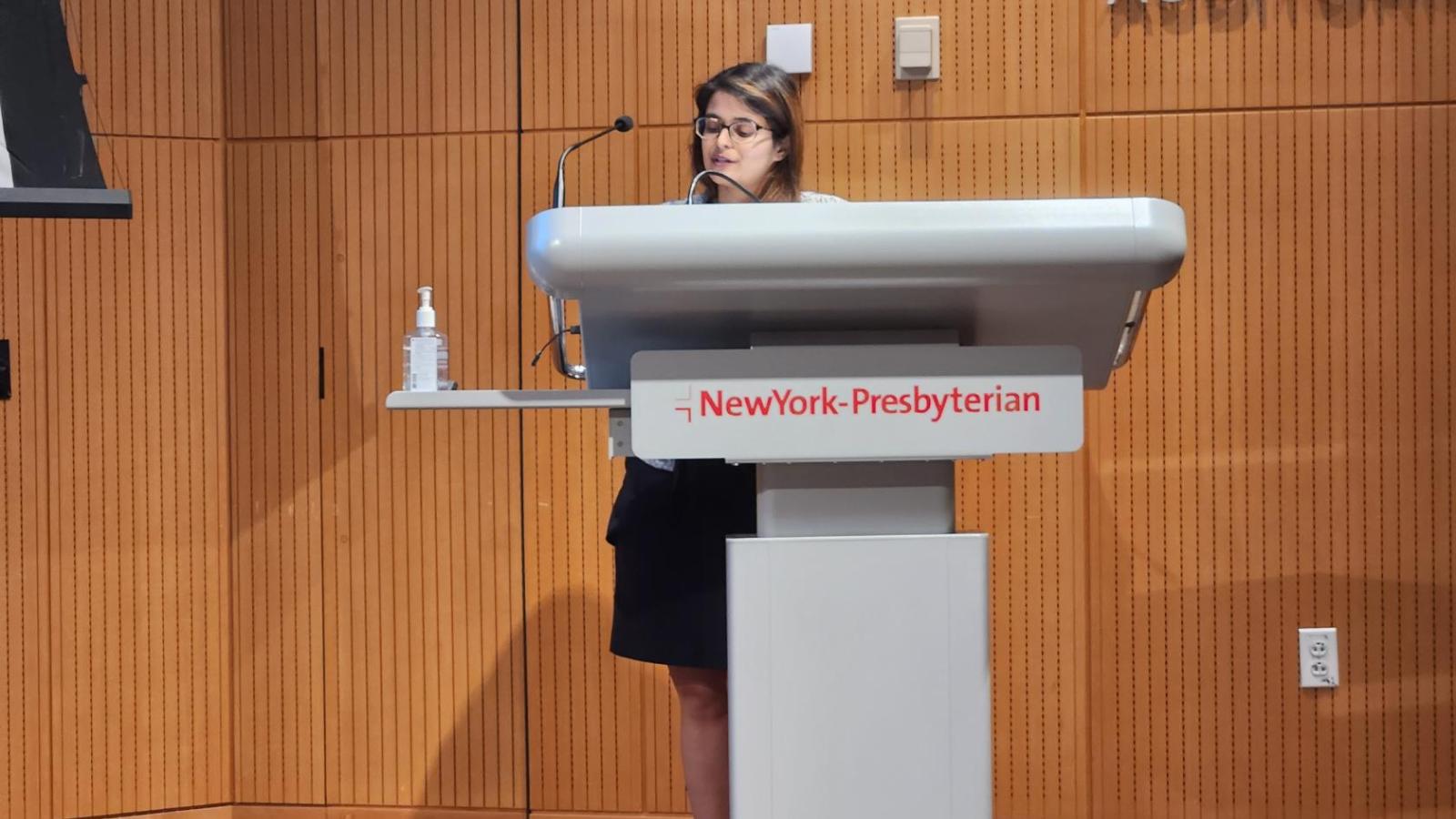 Woman speaking at podium