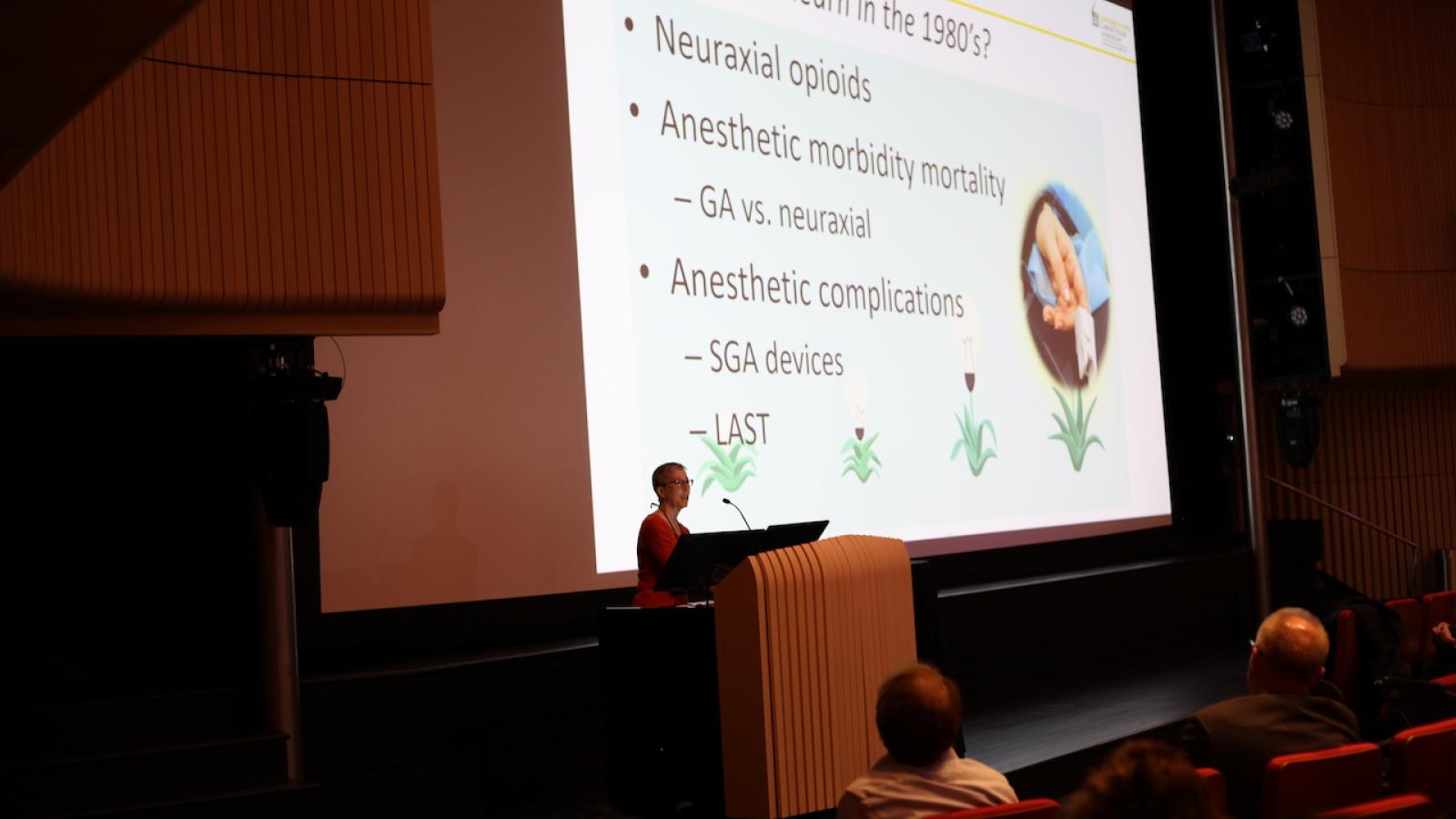 Woman speaking at podium