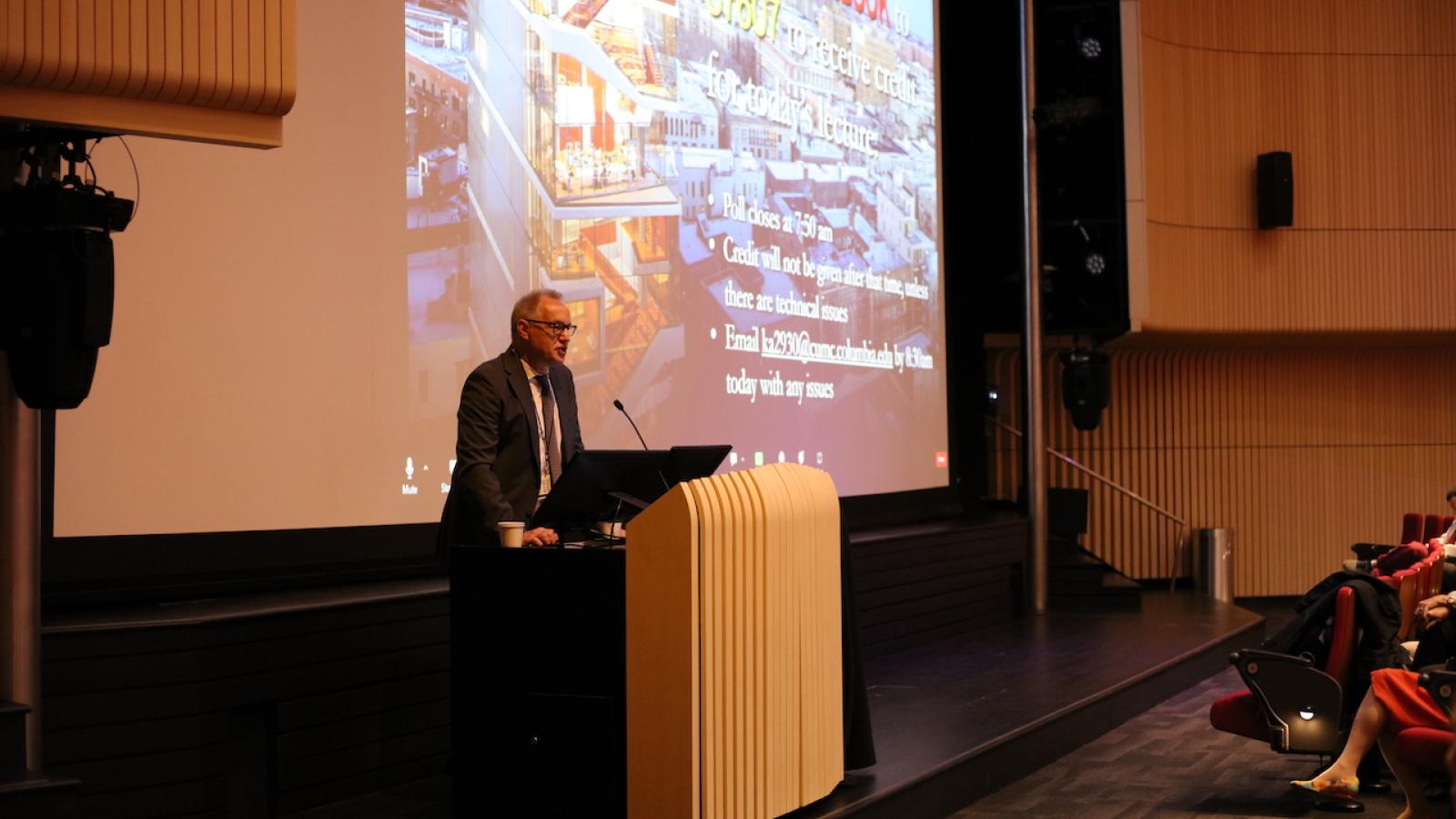 Man speaking at podium