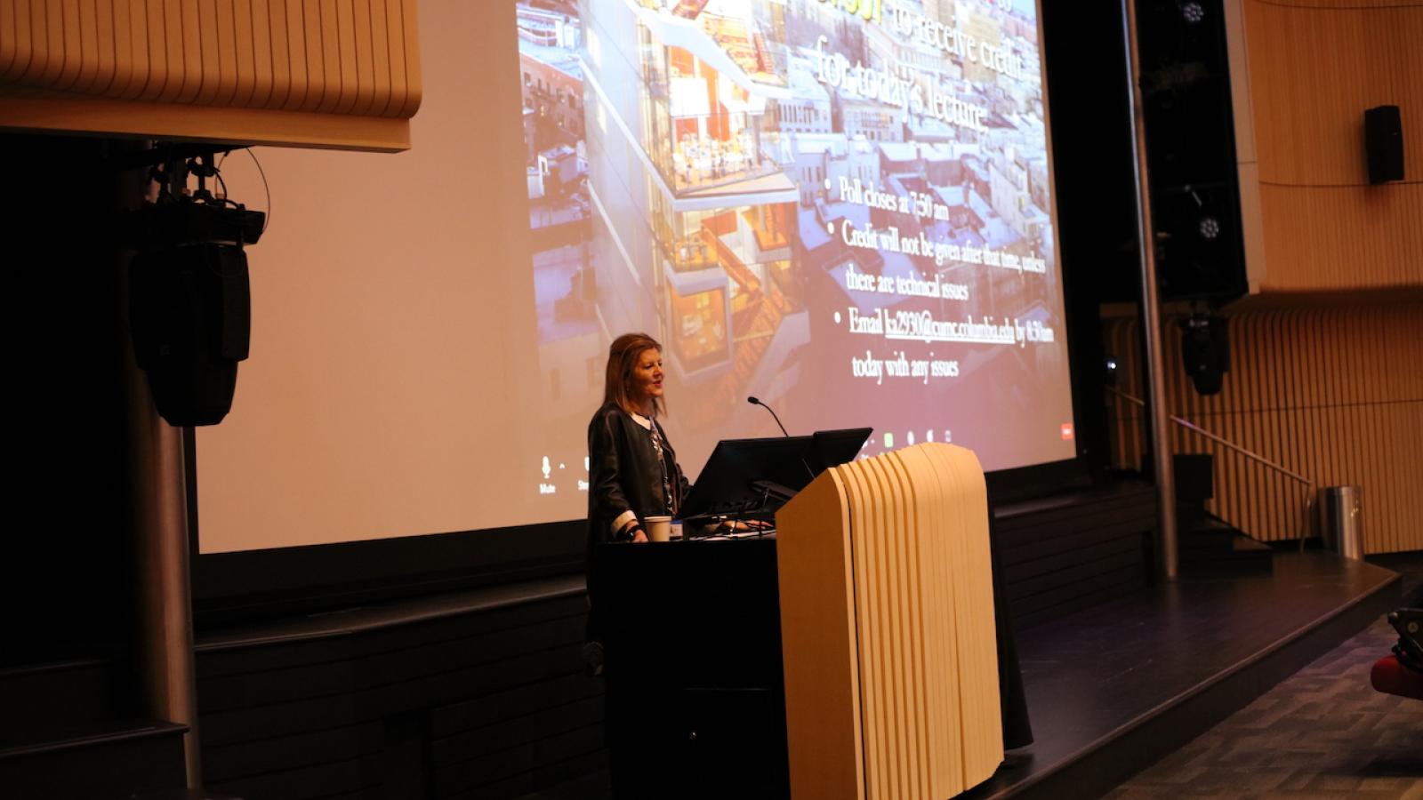 Woman speaking at podium