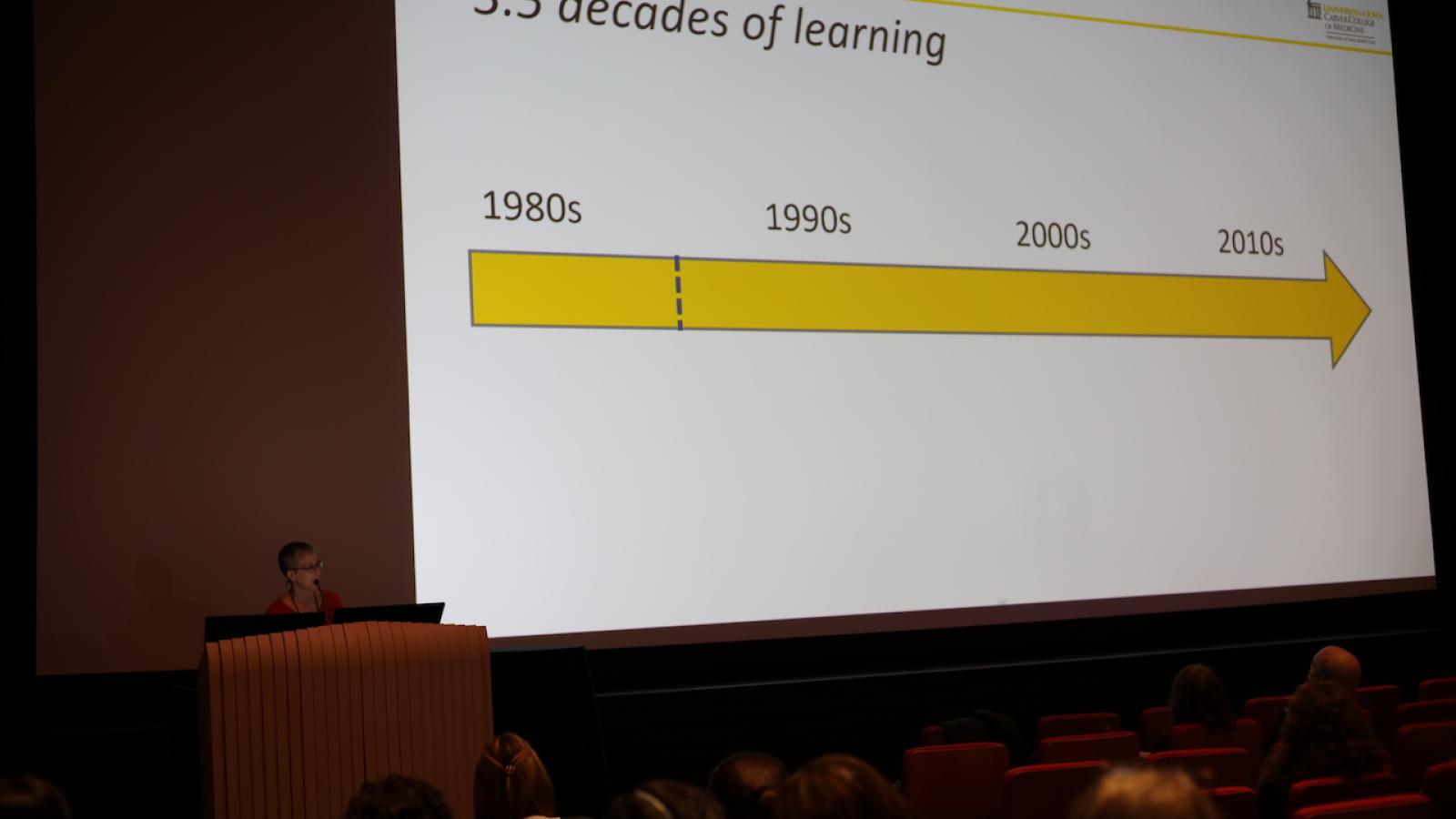 Woman speaking at podium