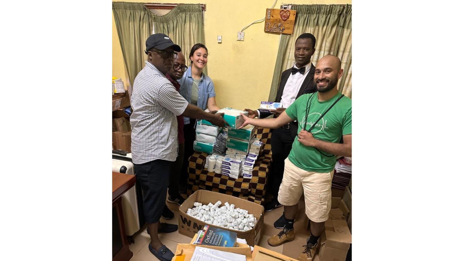 Group of people in a hospital office, opening supplies